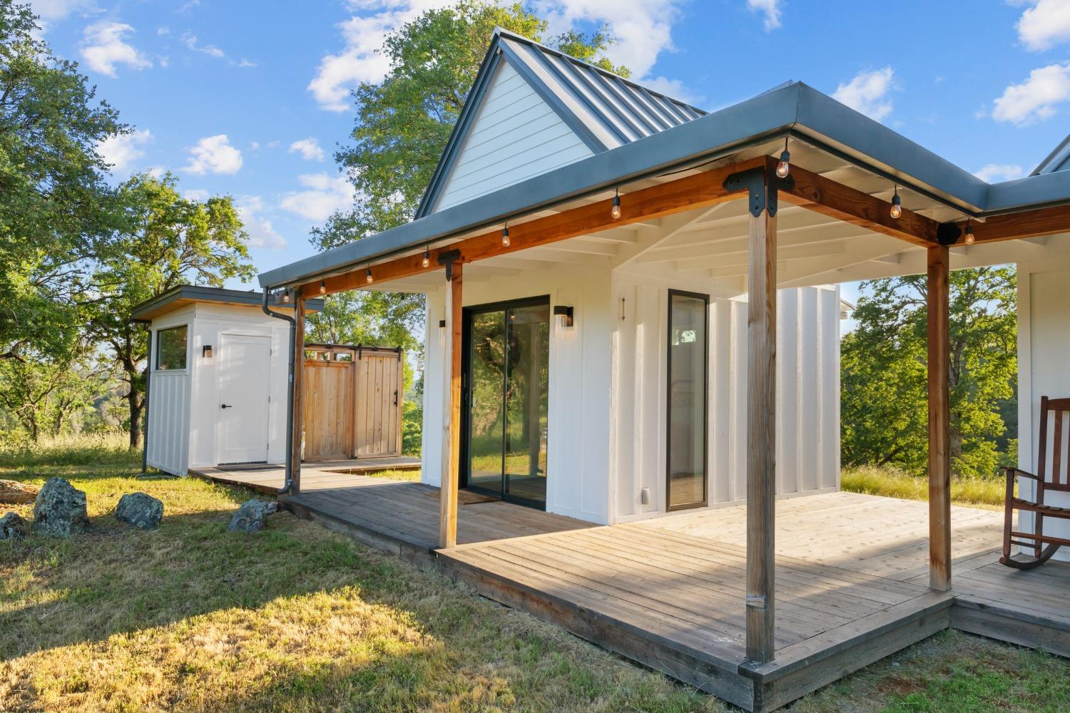 14883 Vaira Ranch Road Drytown, CA 95699 - Photo 13 of 60 a front view of a house with garden