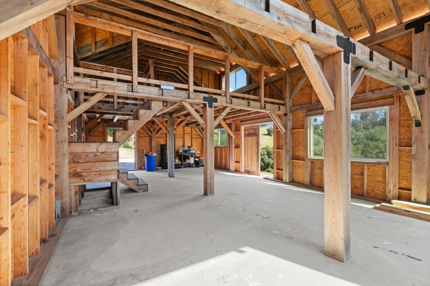 14883 Vaira Ranch Road Drytown, CA 95699 - Photo 29 of 60 a view of a building with a bench