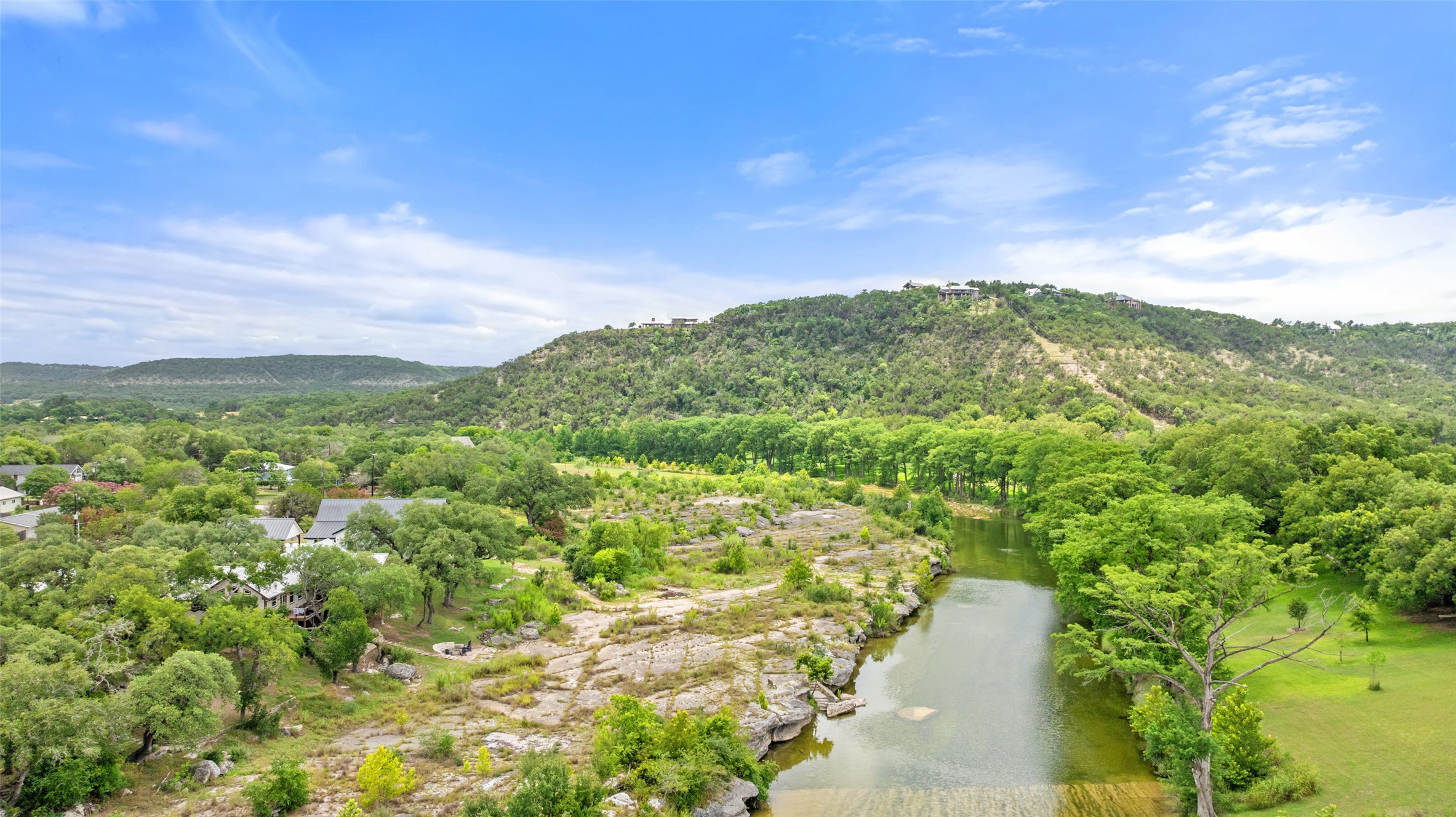 200 Rim Road Wimberley, TX 78676 - Photo 2 of 25 A DOUBLE WOW Blanco River frontage. 2 acres, double lots and private ownership of PRIME Blanco River frontage a stone's throw to Downtown Wimberley!