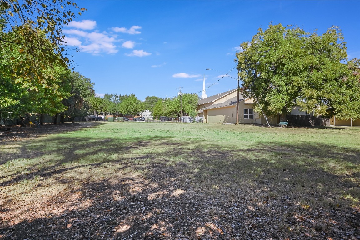 1702 South Lamar Boulevard, Unit 22 Austin, TX 78704 - Photo 29 of 30 a view of a field with trees in the background