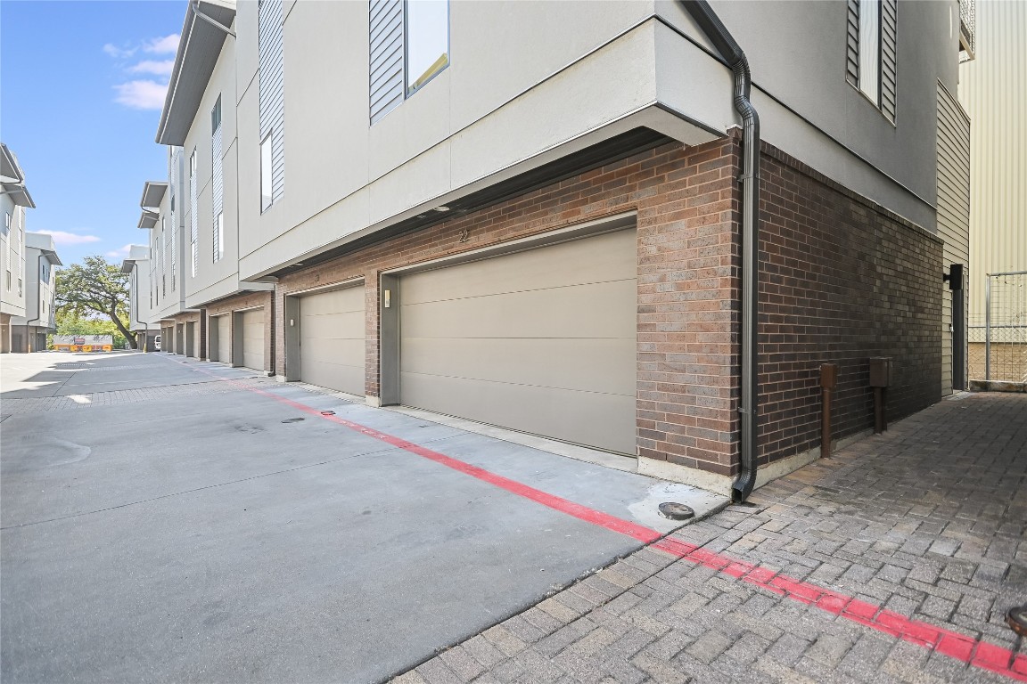 1702 South Lamar Boulevard, Unit 22 Austin, TX 78704 - Photo 5 of 30 a front view of a house with garage
