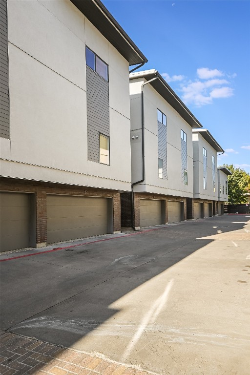 1702 South Lamar Boulevard, Unit 22 Austin, TX 78704 - Photo 6 of 30 a front view of a house with garage
