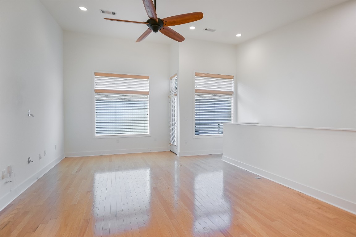 1702 South Lamar Boulevard, Unit 22 Austin, TX 78704 - Photo 8 of 30 an empty room with windows and fan
