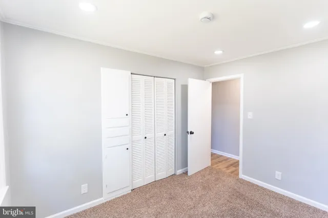 a bathroom with a toilet sink and shower