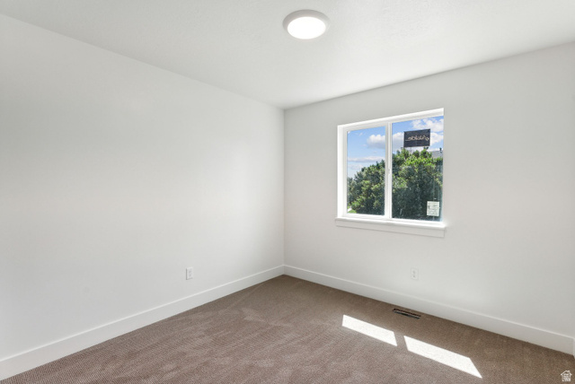 1615 North Angel Street West Layton, UT 84041 - Photo 11 of 22 Carpeted empty room featuring baseboards