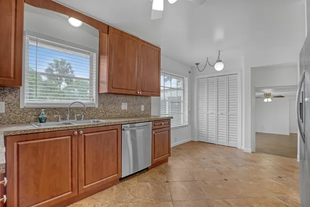 a view of a room with window and cabinet