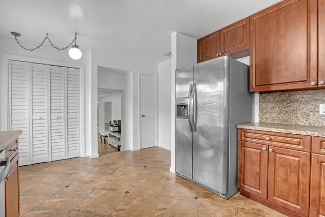 a view of work space with furniture and windows