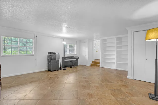 a bathroom with a glass shower door and a sink