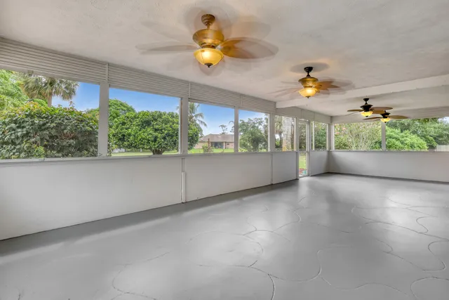an aerial view of a house with outdoor space swimming pool a patio and yard