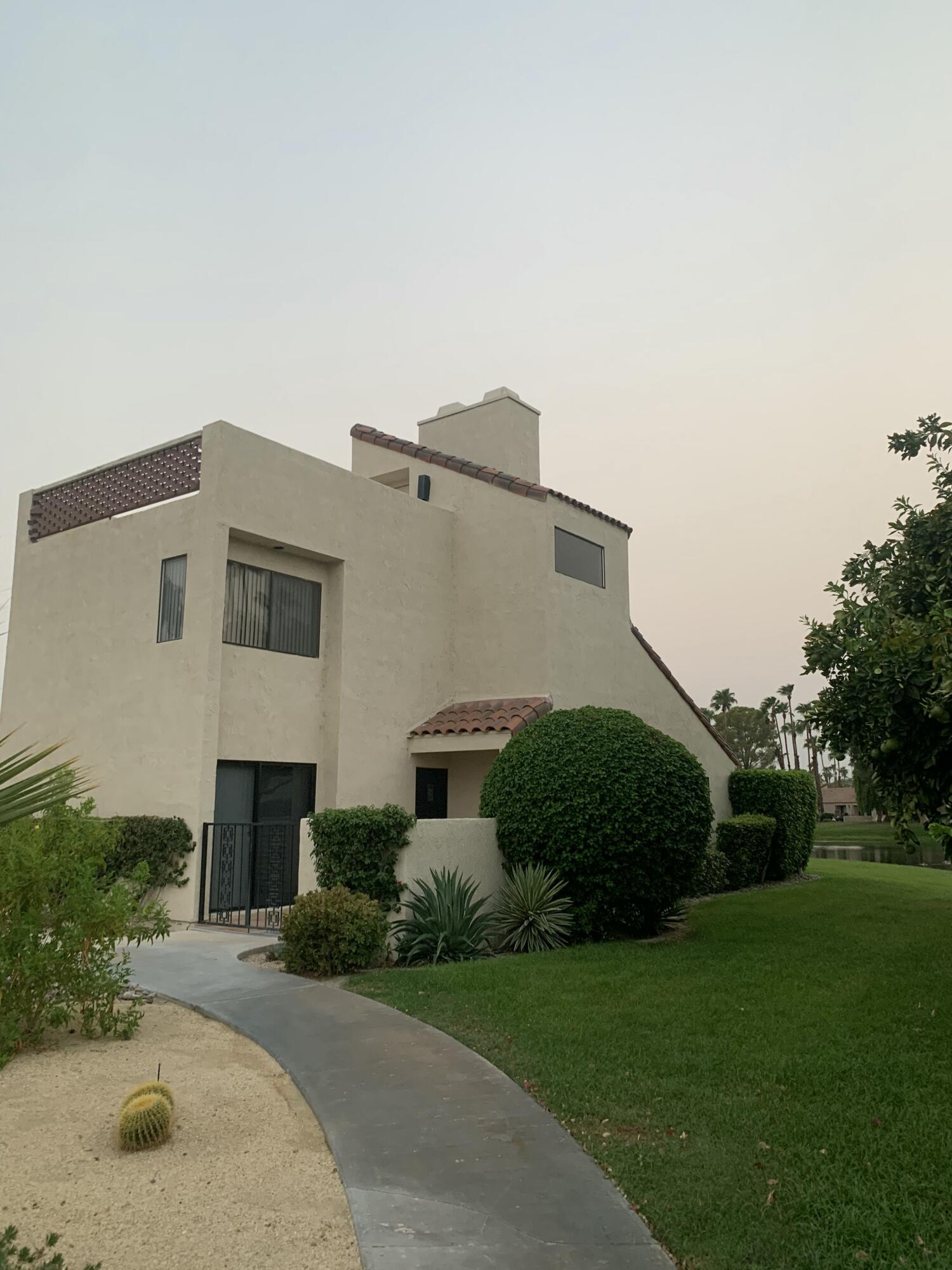 a house view with a garden space