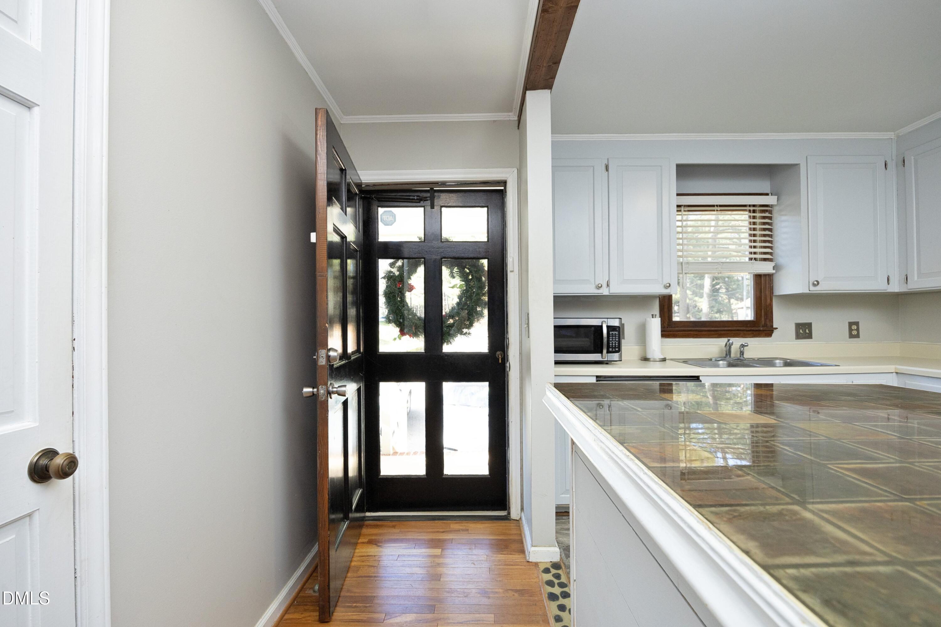 5544 Sharpe Drive Raleigh, NC 27612 - Photo 3 of 37 a large kitchen with a window