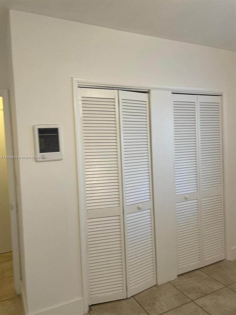 527 Southwest 10th Street, Unit 3 Miami, FL 33130 - Photo 2 of 10 a view of a livingroom with an empty space