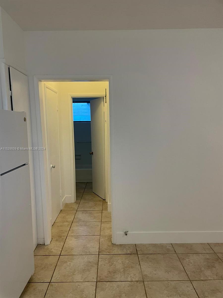 527 Southwest 10th Street, Unit 3 Miami, FL 33130 - Photo 5 of 10 a view of a hallway to rooms