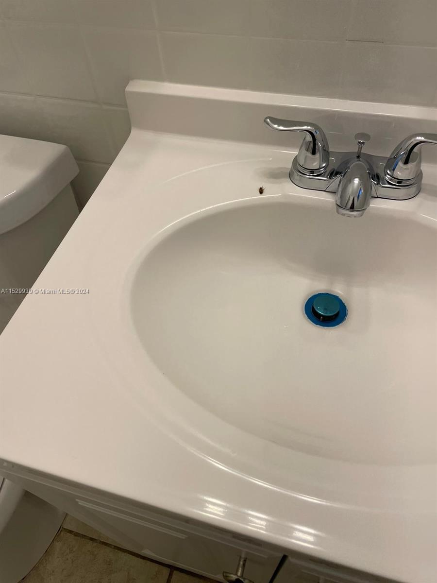 527 Southwest 10th Street, Unit 3 Miami, FL 33130 - Photo 8 of 10 a bathroom with a sink