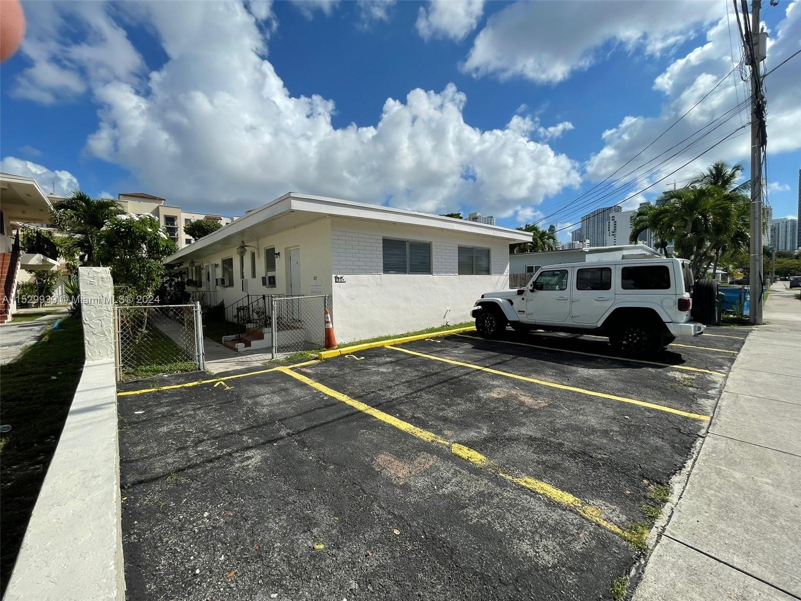 527 Southwest 10th Street, Unit 3 Miami, FL 33130 - Photo 10 of 10 a car parked in front of house