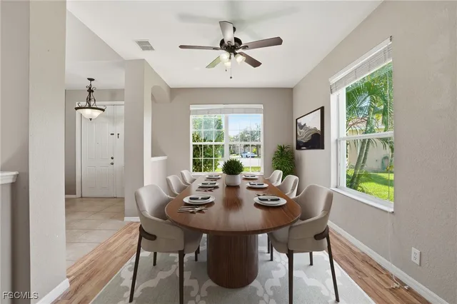 a view of a dining room with furniture window and outside view