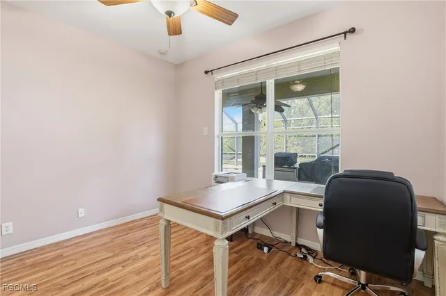 a workspace with furniture and window