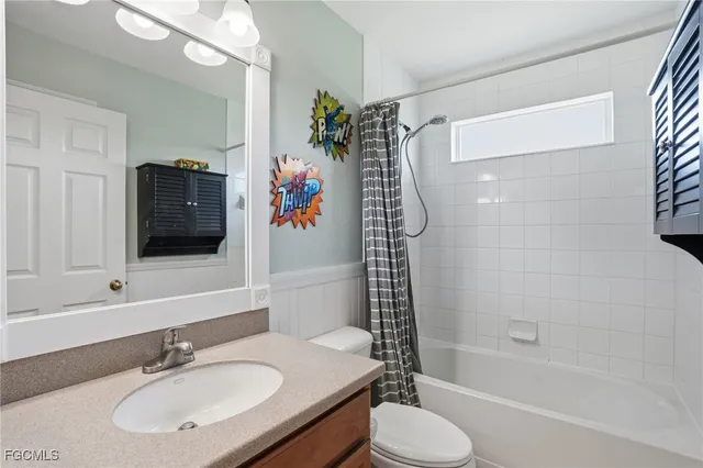 a bathroom with a sink toilet tub and shower