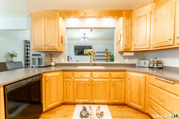 a kitchen with stainless steel appliances granite countertop a sink and cabinets