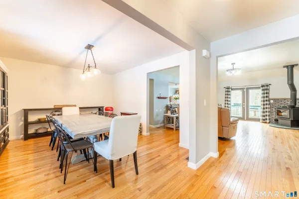 a view of a dining room with furniture and wooden floor
