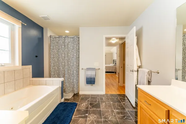 a bathroom with a bathtub and a sink