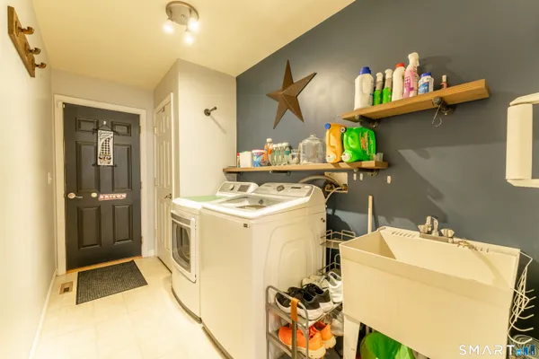 a utility room with washer and dryer