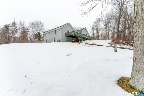 a view of a house with a snow on the road