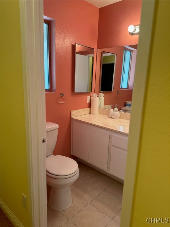 205 Cool Creek Lane Lake Arrowhead, CA 92352 - Photo 14 of 14 a bathroom with a toilet sink and mirror