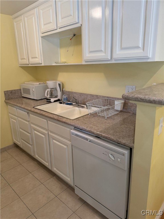 205 Cool Creek Lane Lake Arrowhead, CA 92352 - Photo 8 of 14 a kitchen with granite countertop white cabinets and sink