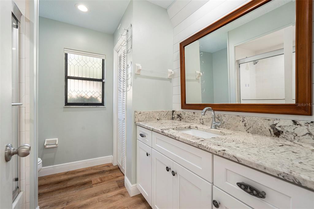 175 Pine Street Homosassa, FL 34446 - Photo 22 of 27 a bathroom with a granite countertop double vanity sink and a mirror