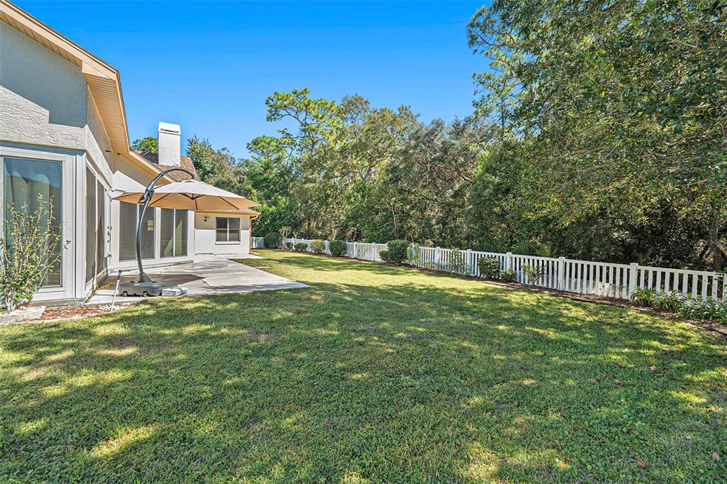 175 Pine Street Homosassa, FL 34446 - Photo 25 of 27 a swimming pool with wooden fence