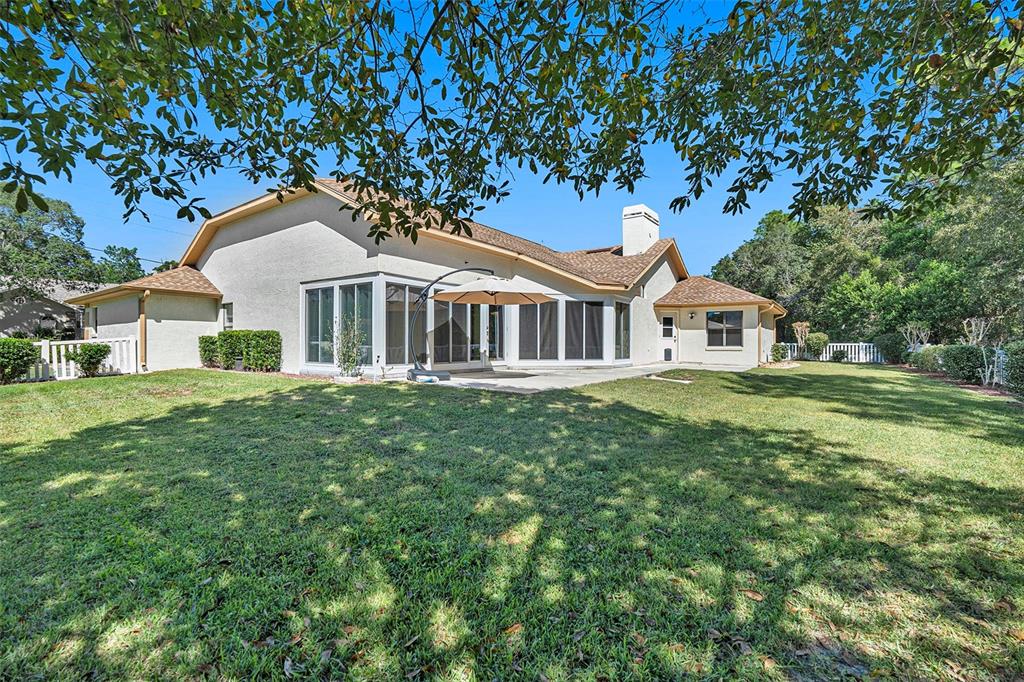 175 Pine Street Homosassa, FL 34446 - Photo 26 of 27 a front view of a house with a garden