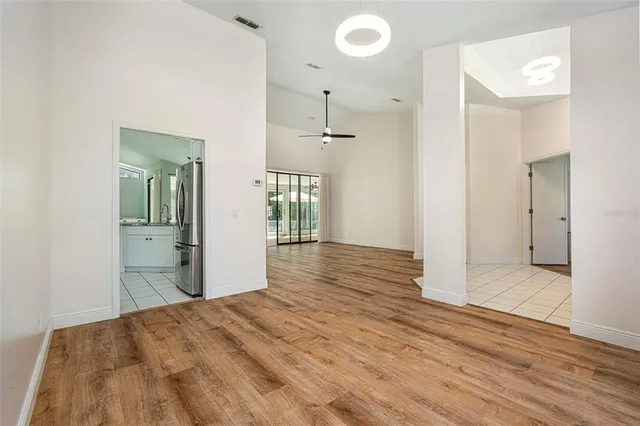 a view of a room with wooden floor and bathroom