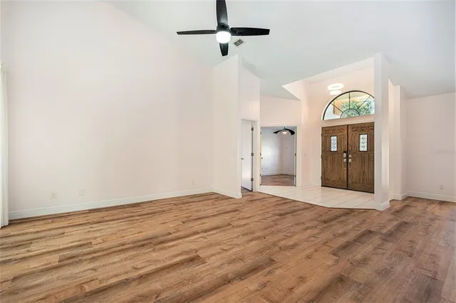 a view of an empty room with glass door
