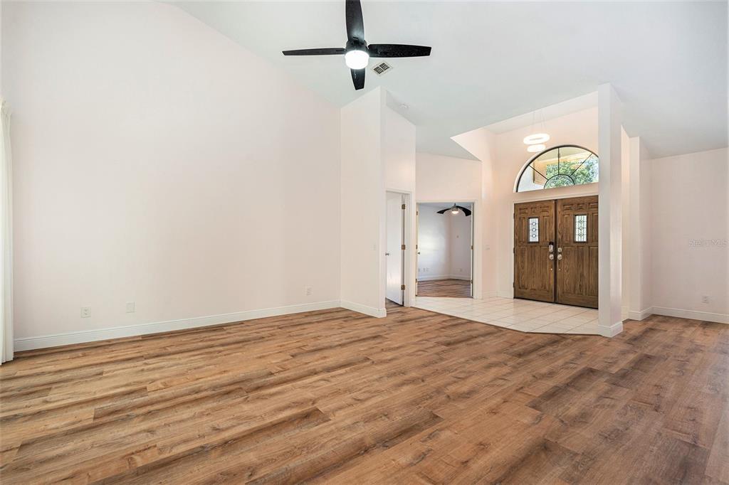 175 Pine Street Homosassa, FL 34446 - Photo 8 of 27 a view of an empty room with glass door
