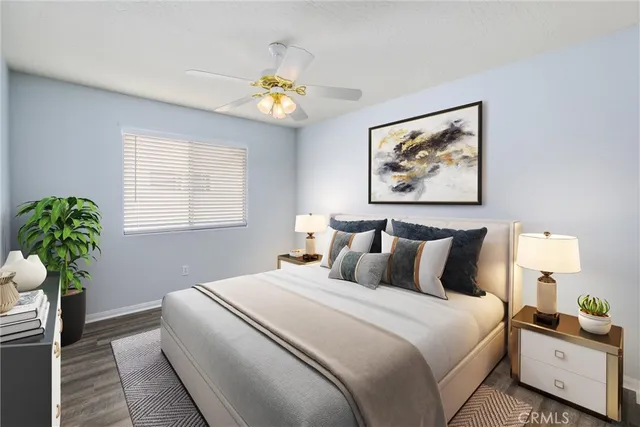 a bedroom with bed and a chandelier