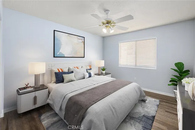 a bedroom with bed and a night stand