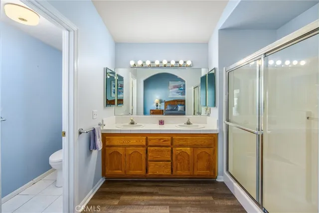 a spacious bathroom with a sink mirror and a bathtub