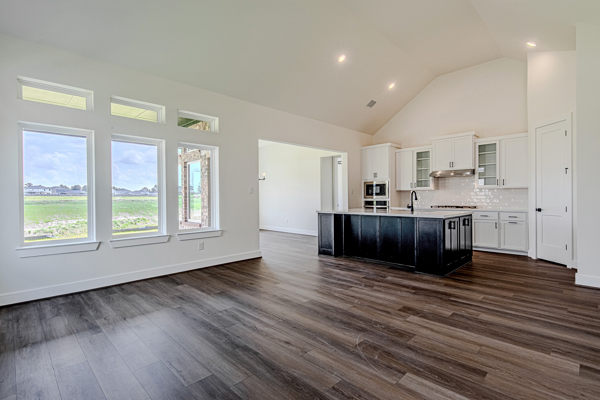 157 Peninsula Point Drive Montgomery, TX 77356 - Photo 13 of 33 a view of kitchen and kitchen with wooden floor
