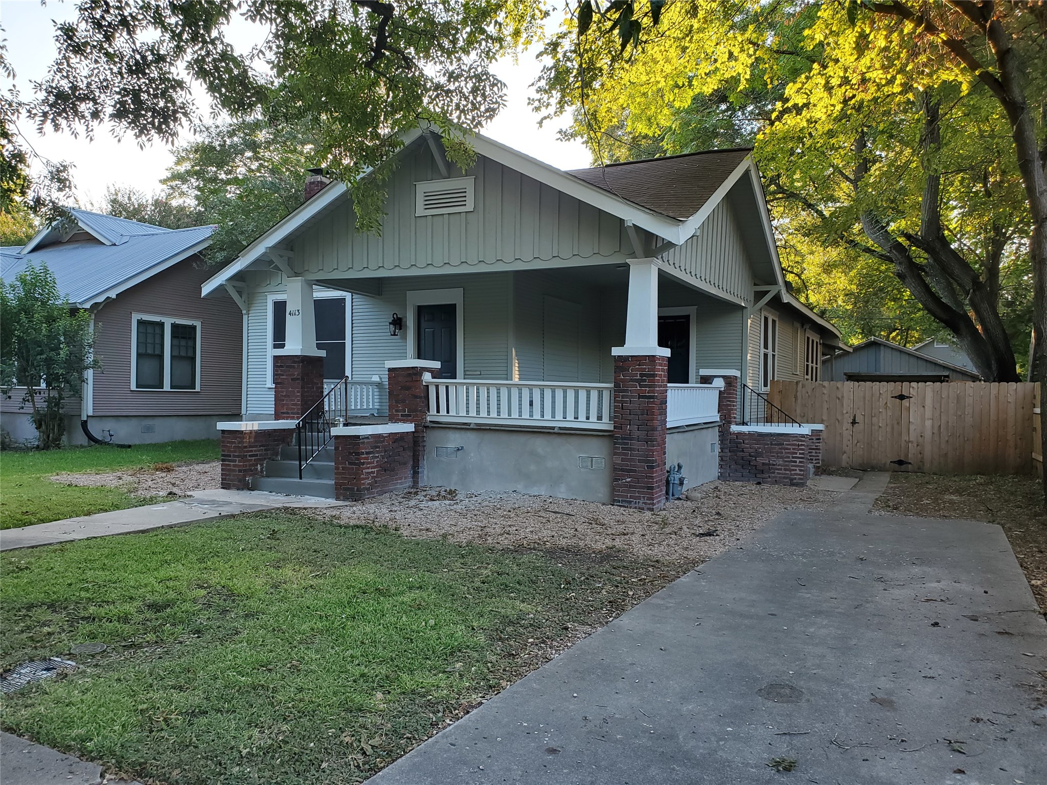 4113 Speedway Austin, TX 78751 - Photo 2 of 31 A welcoming front porch with classic brick columns anchors the facade of this charming home.