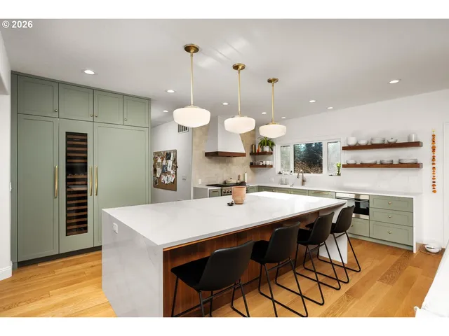a kitchen with a table and chairs in it