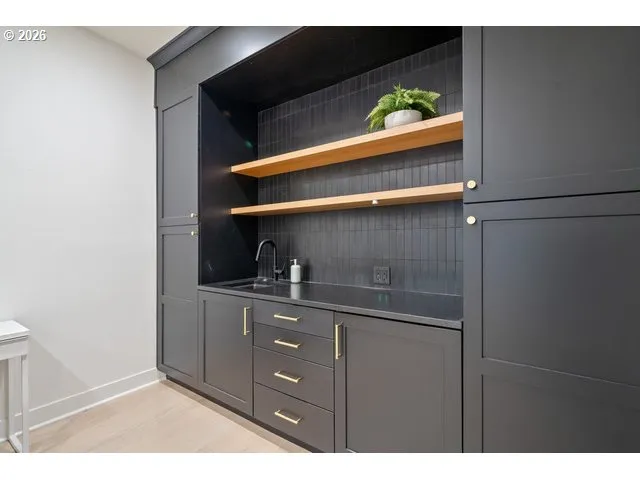 a kitchen with a sink and cabinets