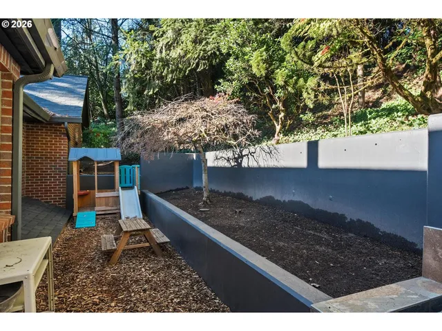 a house view with a backyard space