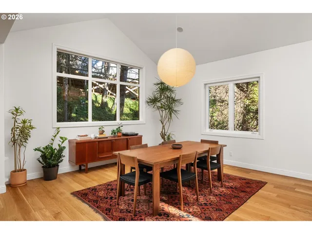 a view of a dining room with furniture and window