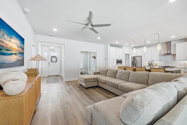 534 Southwest 145th Drive Newberry, FL 32669 - Photo 13 of 38 a living room with furniture and a flat screen tv