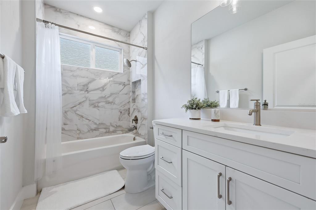534 Southwest 145th Drive Newberry, FL 32669 - Photo 17 of 38 a bathroom with a sink a toilet and shower