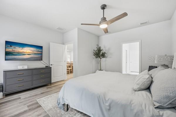 534 Southwest 145th Drive Newberry, FL 32669 - Photo 19 of 38 a bedroom with a bed and a flat screen tv