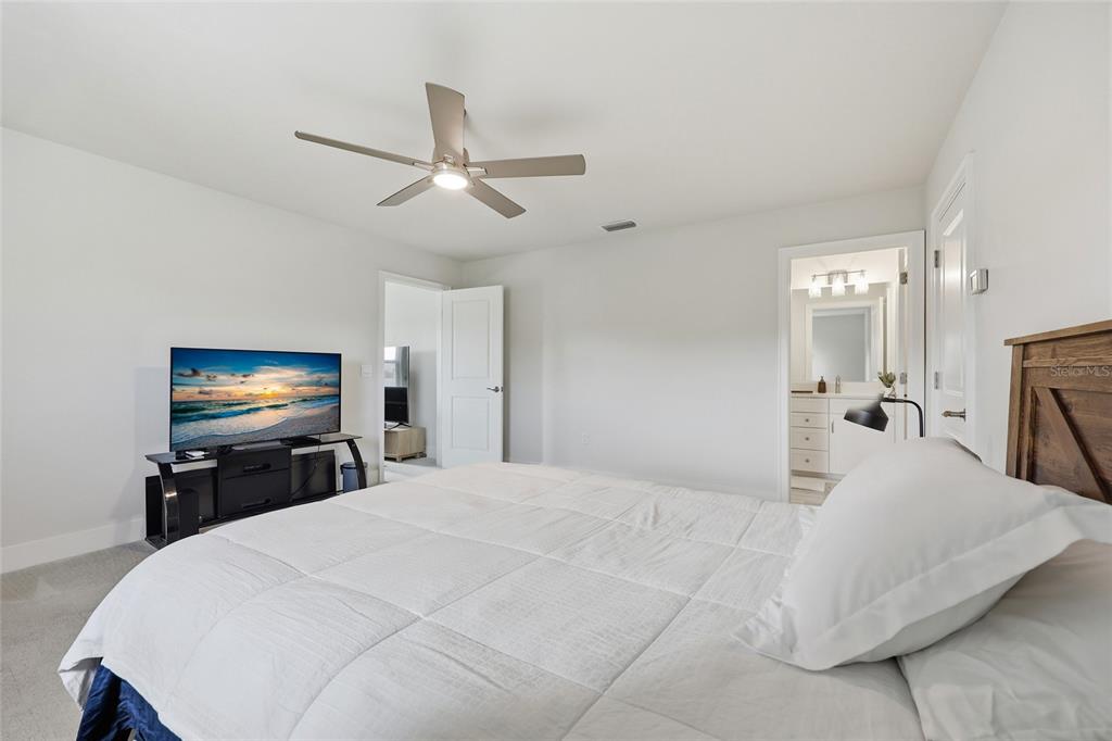 534 Southwest 145th Drive Newberry, FL 32669 - Photo 29 of 38 a bedroom with a bed and a flat screen tv