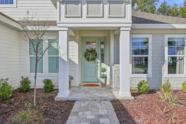 534 Southwest 145th Drive Newberry, FL 32669 - Photo 34 of 38 a view of a brick house with potted plants