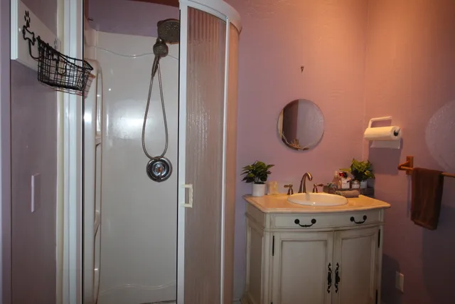a bathroom with a sink and a mirror
